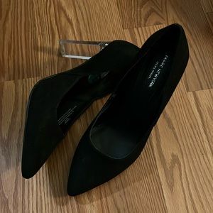 Black pumps with clear heels